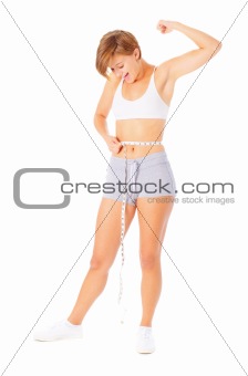 Young Woman Measuring Herself