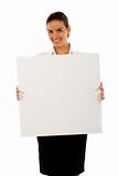 businesswoman showing empty white board