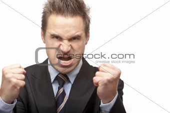 Businessman is quite angry and shows fists 