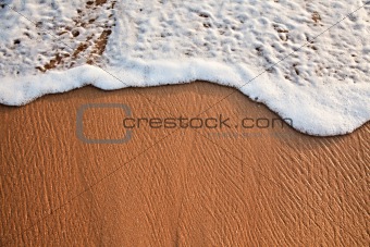 Wave surging on sand