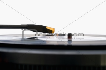 close up of an old vinyl record player on white background