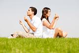 young couple doing meditating 