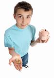 Boy holding coins for money box