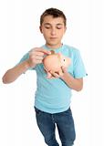 Child placing coins into a piggy bank