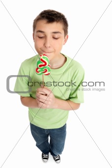 Boy holding a sweet yummy Christmas candy
