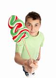 Boy showing lollipop candy