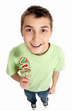 Happy boy holding a lollipop candy