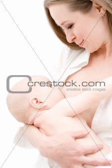 Little baby girl breast feeding.