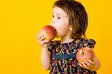 Little girl with two apple
