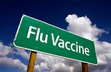 Flu Vaccine Road Sign with dramatic blue sky and clouds.