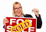 Attractive Blonde Holding Keys & Sold For Sale Sign Isolated on a White Background.