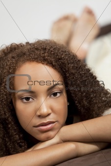Beautiful Mixed Race African American Girl Laying Down on Settee