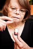 Woman with small pill and case