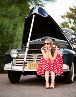 Girl in red with vintage car