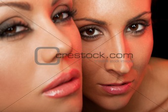 two beautiful female faces