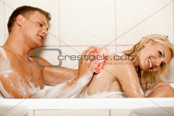 Man bathing his wife