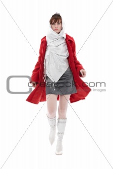 Woman in red coat is walking