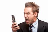 Businessman has stress and sreams into mobile phone 