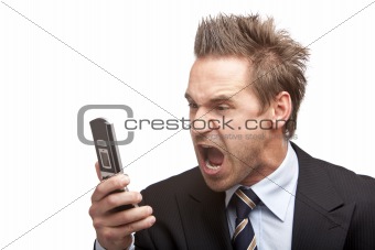 Businessman has stress and sreams into mobile phone 