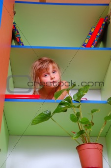 child in the bookcase