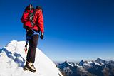 Mountaineer on a snowy ridge