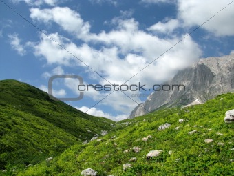 top; sky; rocks; a reserved zone; green