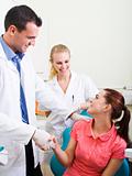 dentist or doctor congratulate patient