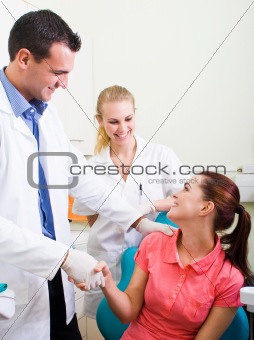 dentist or doctor congratulate patient