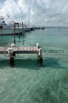 Wood pier in clear caribbean sea - Mexico