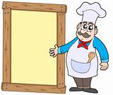 Chef with wooden panel