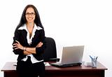 businesswoman with glasses against office desk