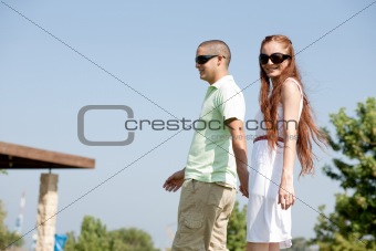 young couple walk on the park