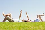 couple lie down on grass