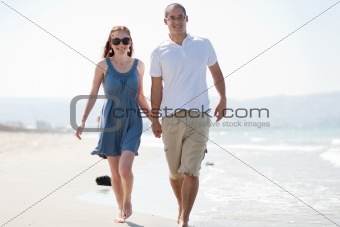 love couple walk on the beach