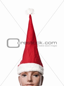 Santa claus hat on a doll