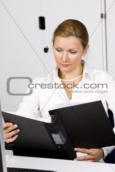 beautiful young woman working with documents