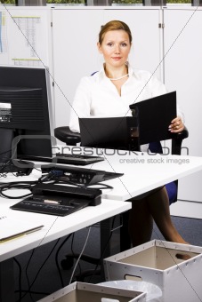 beautiful young woman working with documents