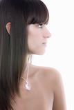 Beautiful woman portrait with jewelry on her. Side view isolated