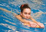 young girl is swimming