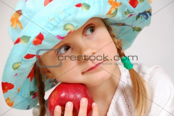 girl with hat and apple