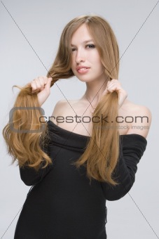 Girl holding her hair