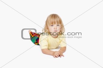 boy with long blond hair lying down, looking at camera - clipping path