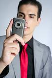 Businessman taking photos with phone camera