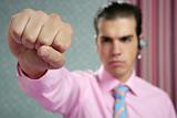 angry aggresive businessman with fist closeup