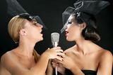 Beautiful women singing on a vintage microphone