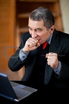 Man either checking his shares on the internet