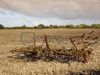 harrows in a plowed field