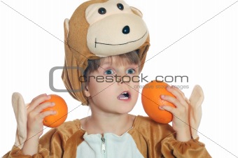 monkey child with oranges
