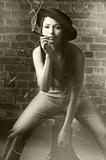 sitting and smoking cigar in a vintage shot