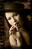 closeup of beauty chinese smoking cigar